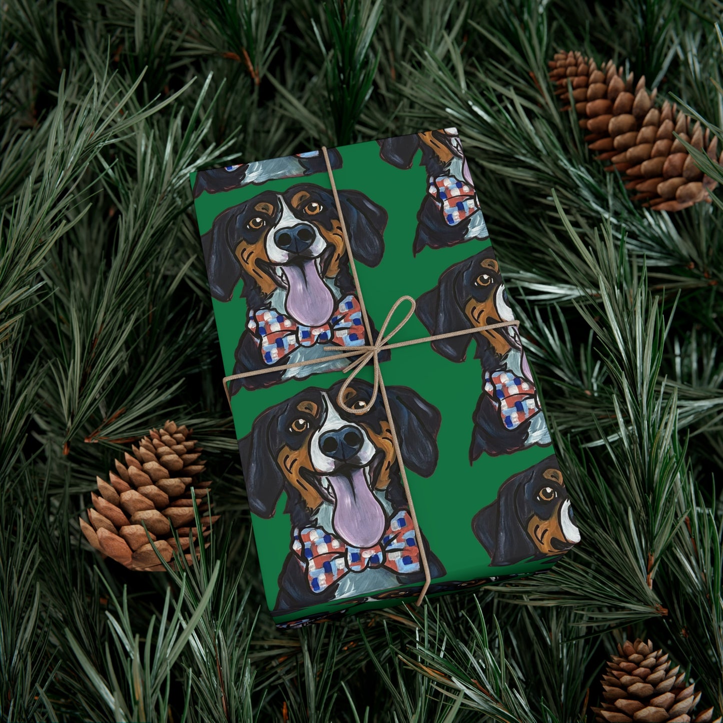 Gift box wrapped in green wrapping paper featuring custom hand drawn dog caricature portrait in a christmas tree