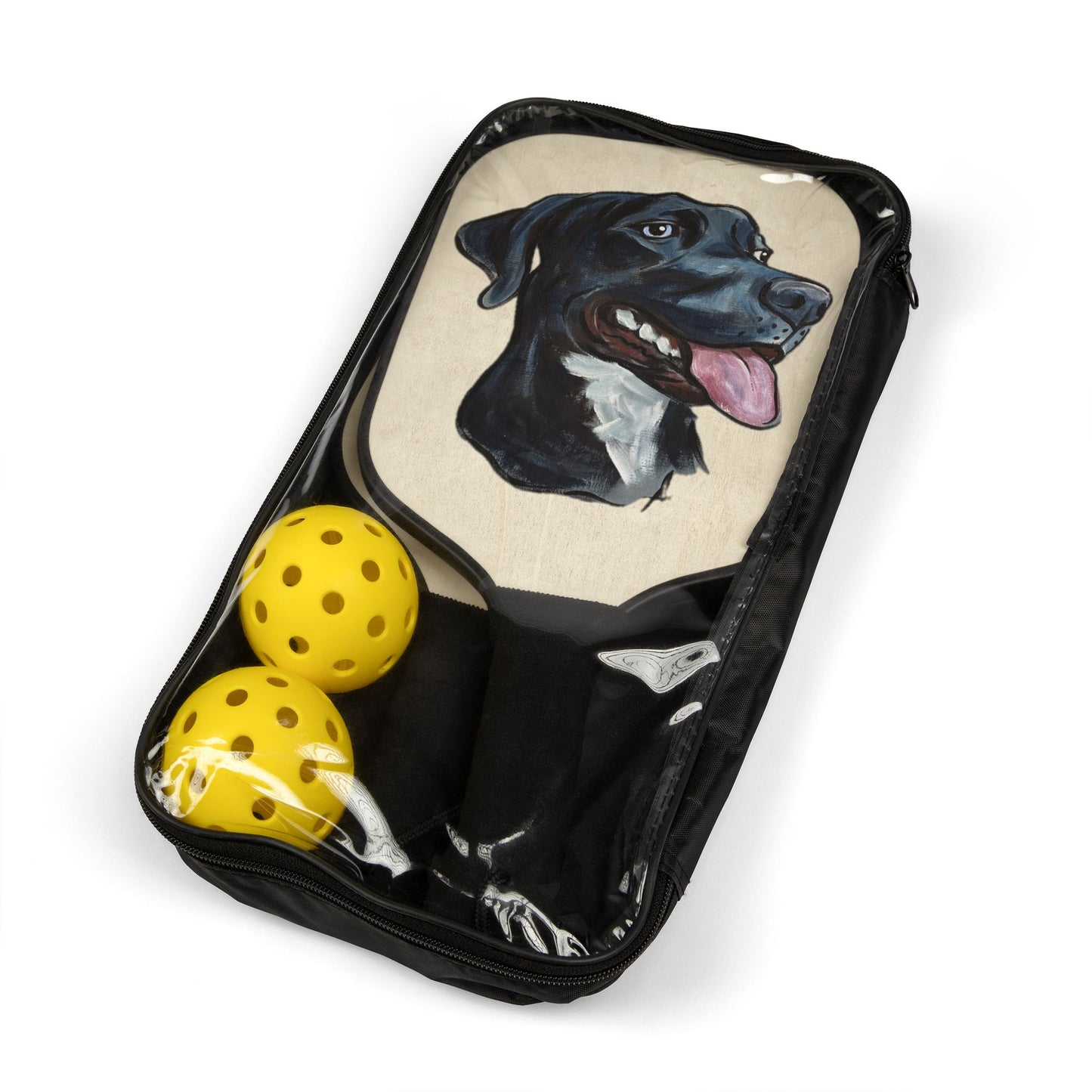 Pickleball paddles with a custom dog caricature portrait design in a carrier bag with two yellow pickle balls