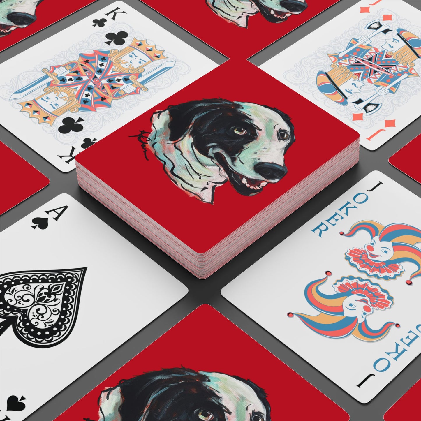 Set of red playing cards featuring a hand drawn custom dog caricature portrait.