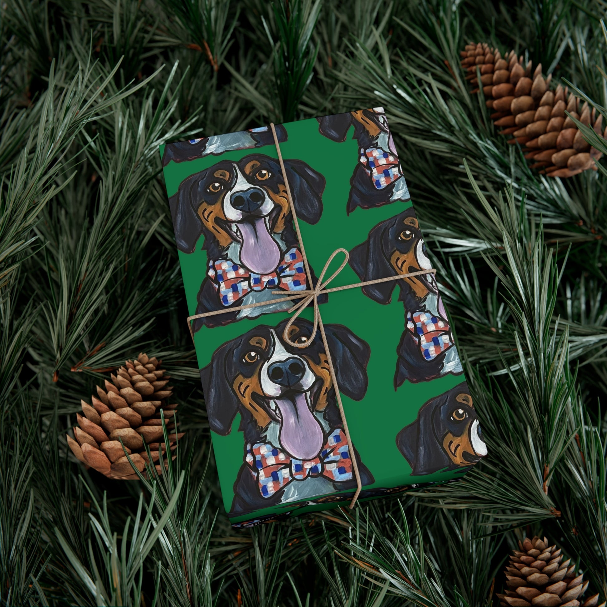 Gift box wrapped in green wrapping paper featuring custom hand drawn dog caricature portrait in a christmas tree