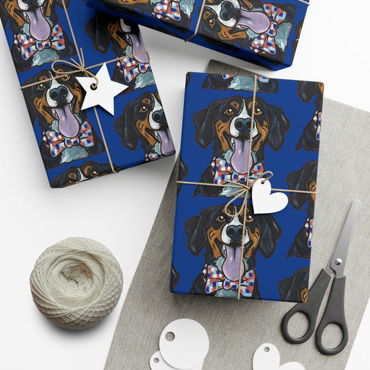 Gift wrap with dog pattern on blue background, scissors, yarn, and tags on white surface