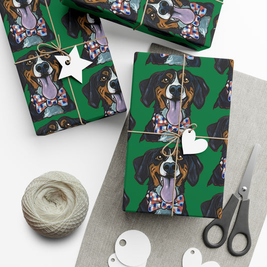 Gift boxes wrapped in green wrapping paper featuring custom hand drawn dog caricature portrait,  scissors, and yarn on a white surface.